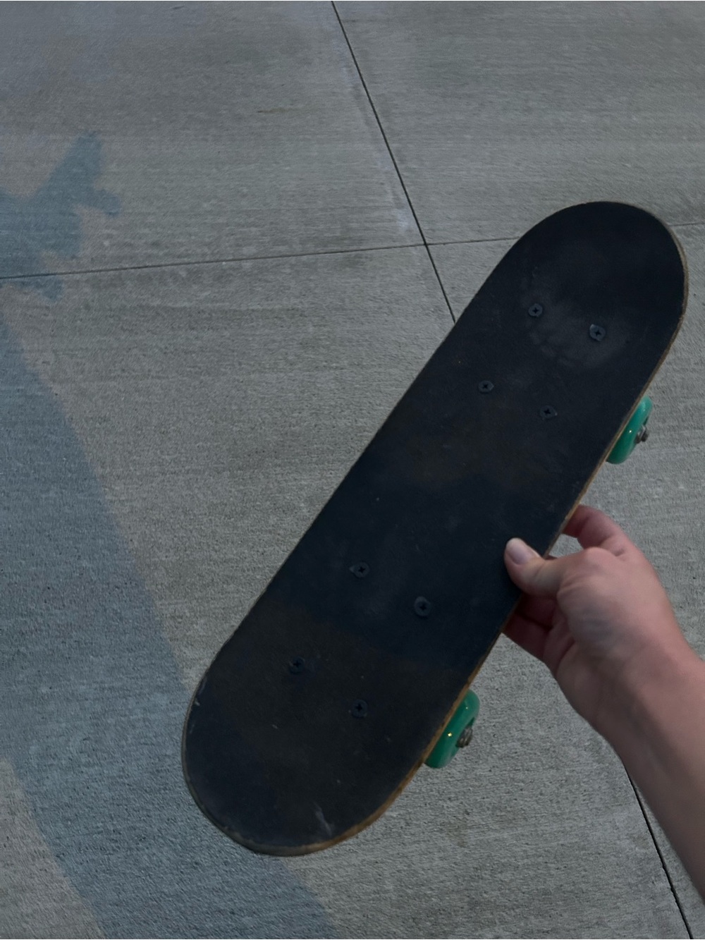 Classic Black Skateboard with Green Wheels